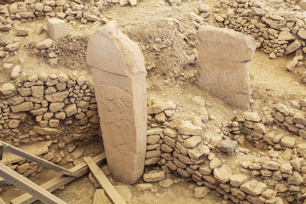 Close-up of T-shaped stone pillars at Göbekli Tepe with animal carvings