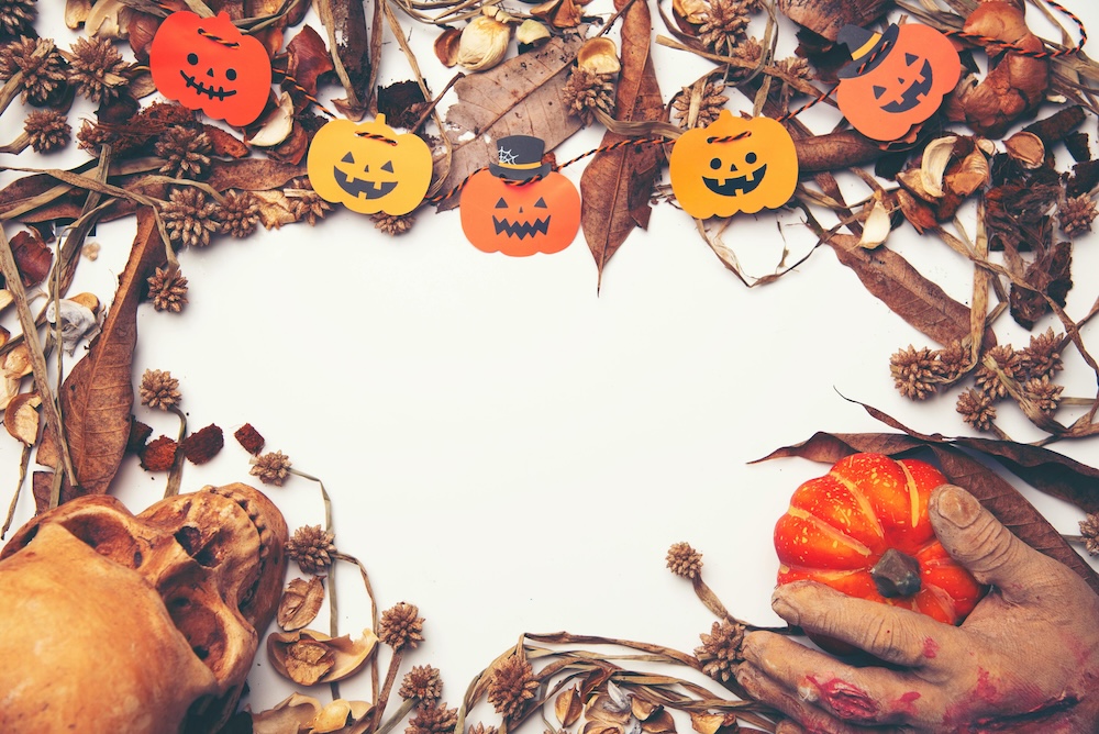 Halloween decorations with autumn leaves and jack-o-lanterns