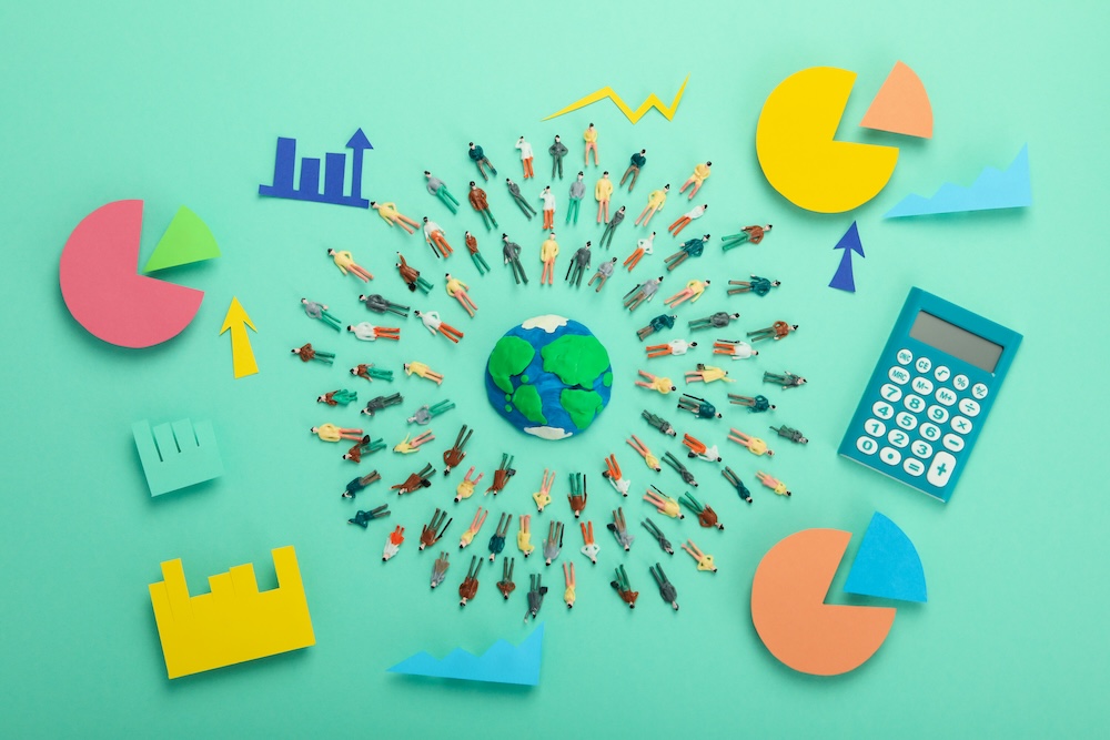 Stakeholder capitalism visualization with diverse people figures around a globe with charts and arrows