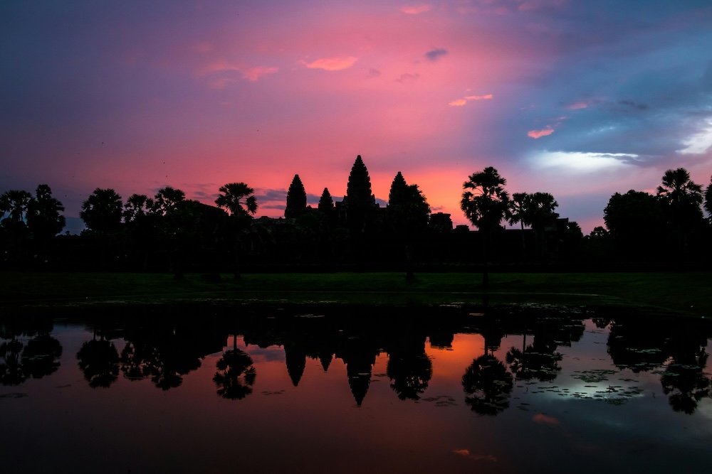 Detailed stone carvings and reliefs at Angkor Wat depicting Hindu mythology