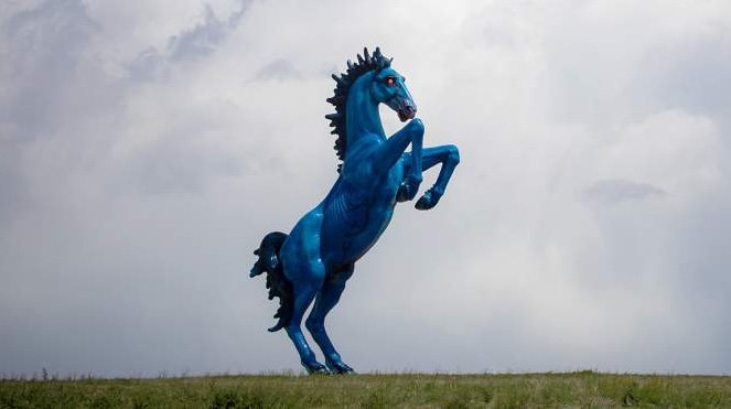 Blucifer the blue mustang statue with glowing red eyes at Denver International Airport